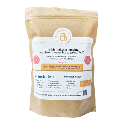 Kraft paper packaging with a label for a hanging rainbow kit on a white background
