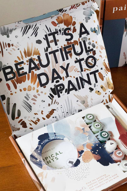 Art supply set with 'It's a Beautiful Day to Paint' sign