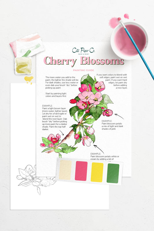 Art paper with cherry blossom illustration, color swatches, and stationery items on a white background