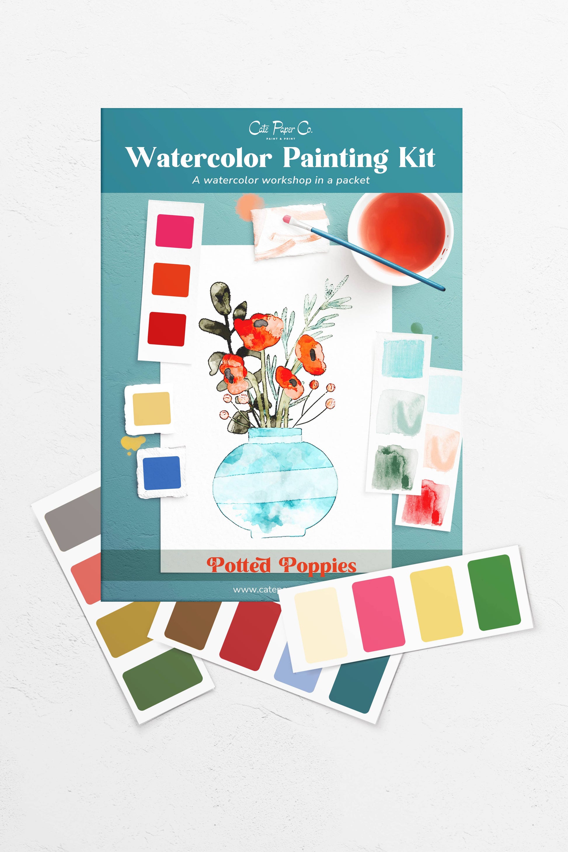 Watercolor painting kit with color swatches and a floral design on a white background
