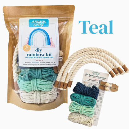 Display of teal diy rainbow macrame kit on white background.